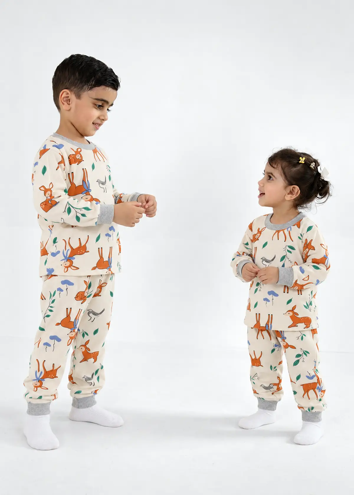 Boy and girl wearing Little Deer Fleece Nightwear, cream fleece set