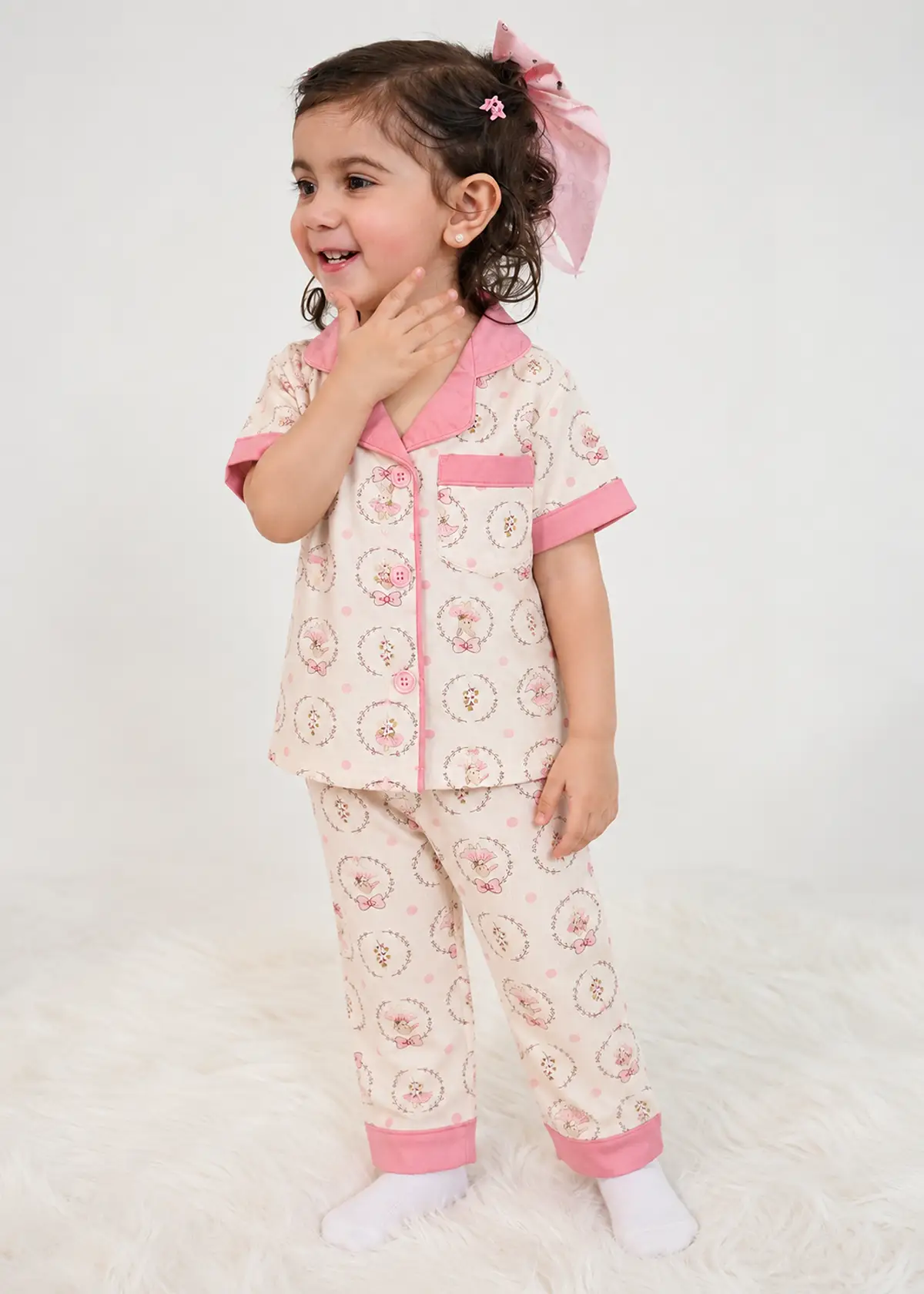 Girl wearing Blush Ballerina half sleeve nightwear, cream with a pink collar and ballerina bunny print