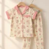 Rosy Bunny half sleeve nightwear for girls, cream top and pants with pink trim on hangers