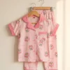 Pink Daisy half sleeve nightwear for girls, pink top and pants with duck print on hangers